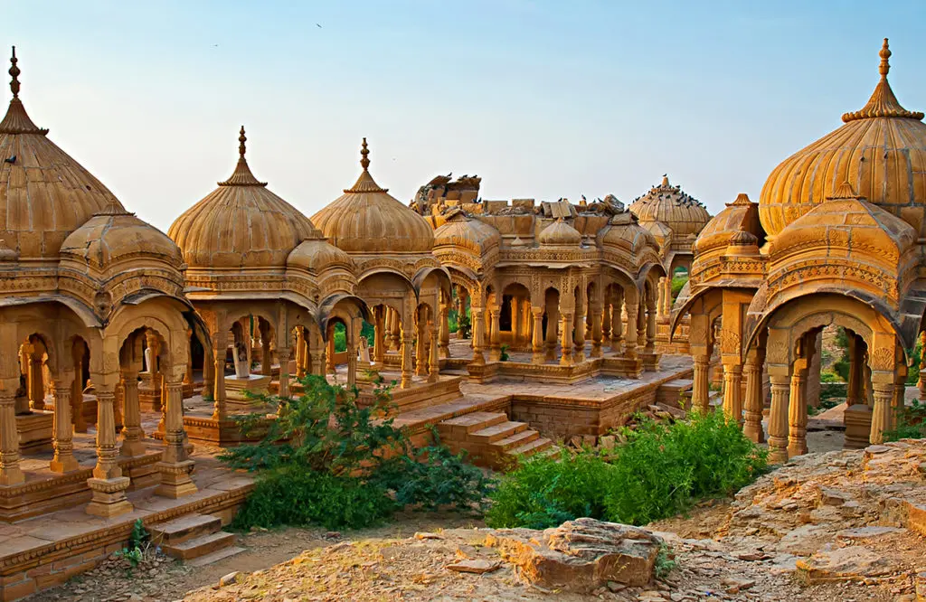 28.31.13 The royal cenotaphs of historic rulers also known as Jaisalmer Chhatris at Bada Bagh in Jaisalmer made of yellow sandstone By Olena Tur 1024x666 1
